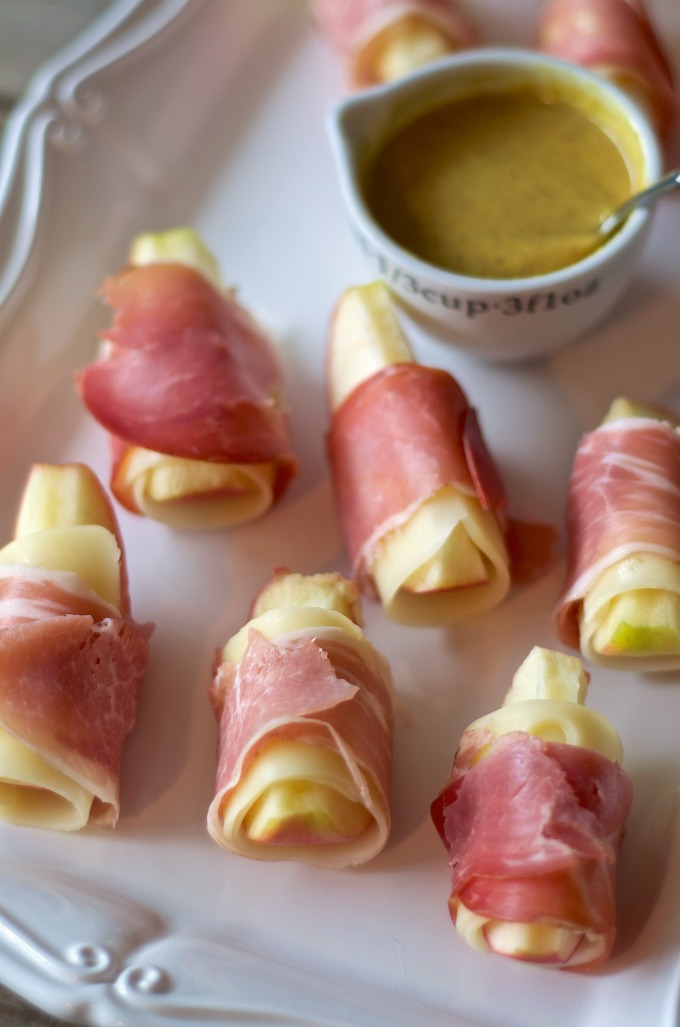 Swiss cheese and prosciutto wrapped apples
