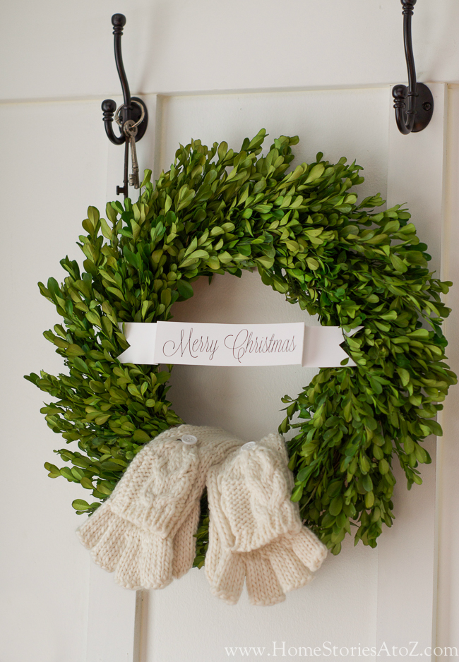 Place mittens on boxwood wreath for a fun decoration