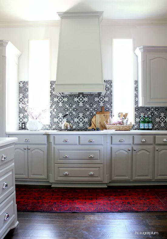 white kitchen hood gray kitchen cabinets