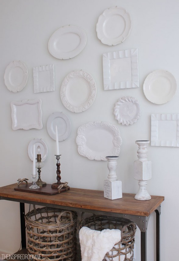 Hang white plates on wall. Easy and inexpensive decorating with plates