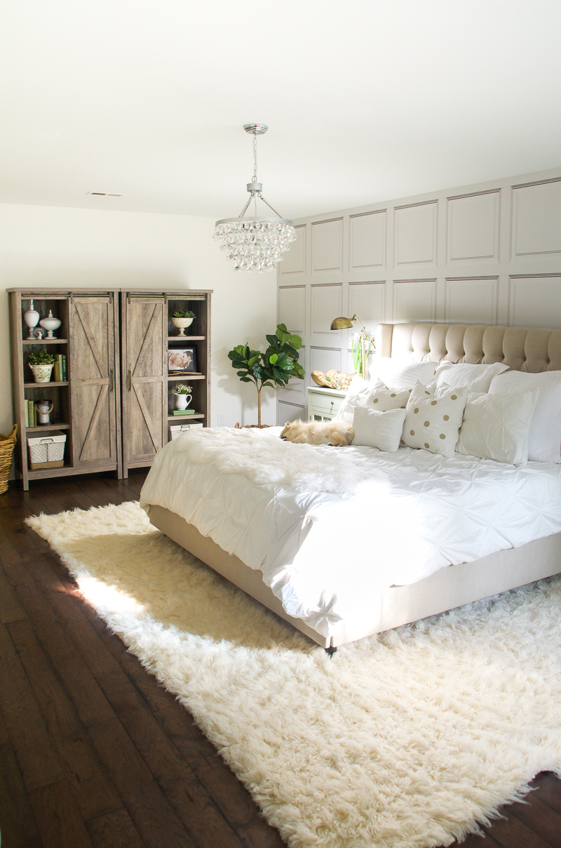white bedroom makeover barn door storage cabinet