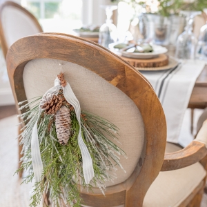 Beautiful and Easy Christmas Decor Ideas - Hang a swag on your chairs - Home Stories A to Z