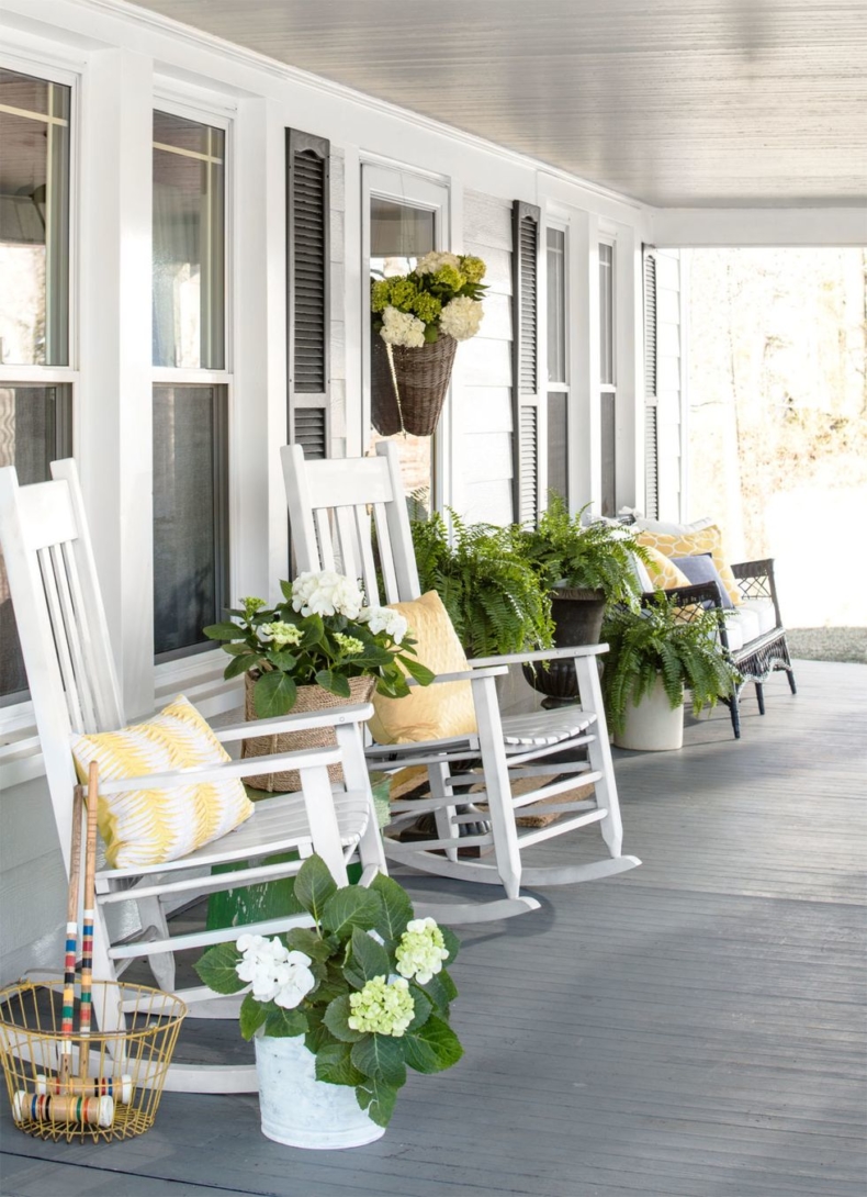 Spring Porch and Patio Ideas - Farmhouse Porch by Trinity Holmes via Country Living