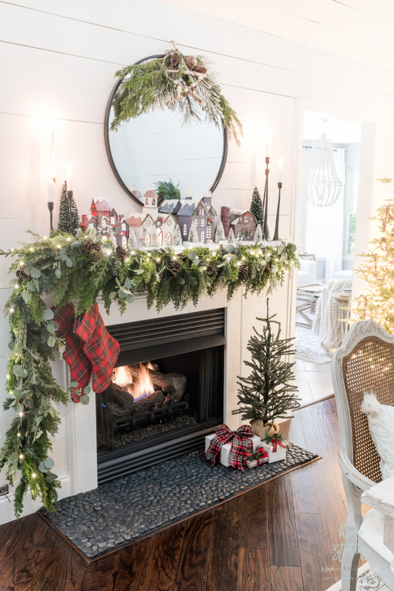 Christmas Mantel Decorating Ideas - Cozy Traditional Mantel with Christmas Village by Home Stories A to Z