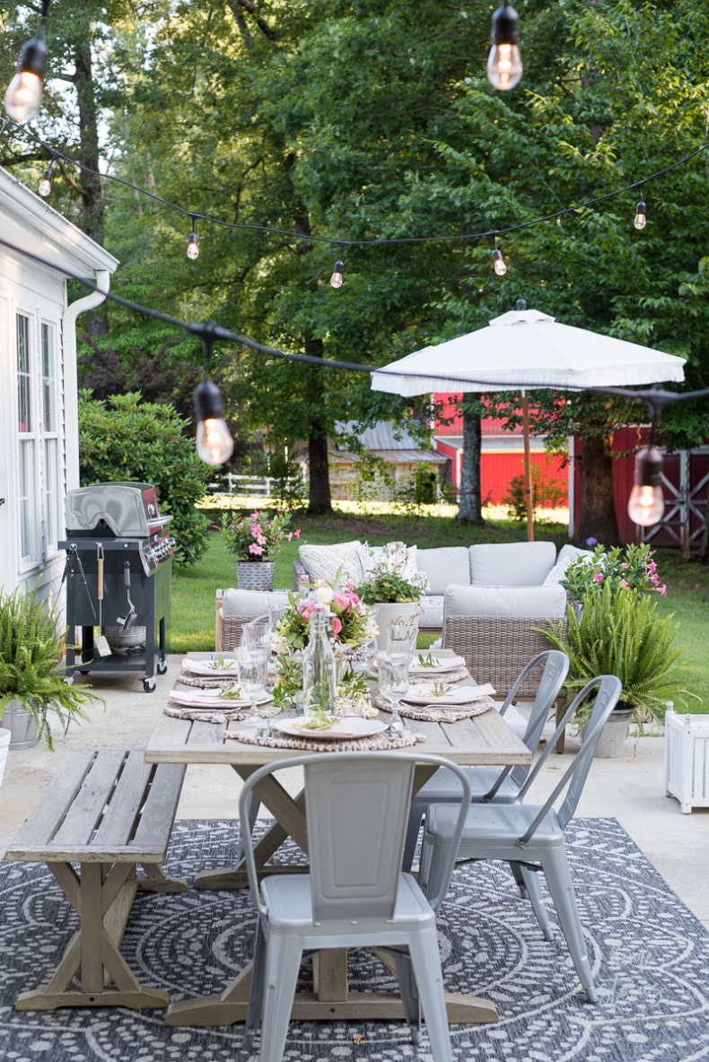 Dining Outdoors in the Spring - Hanging String Lights by Home Stories A to Z