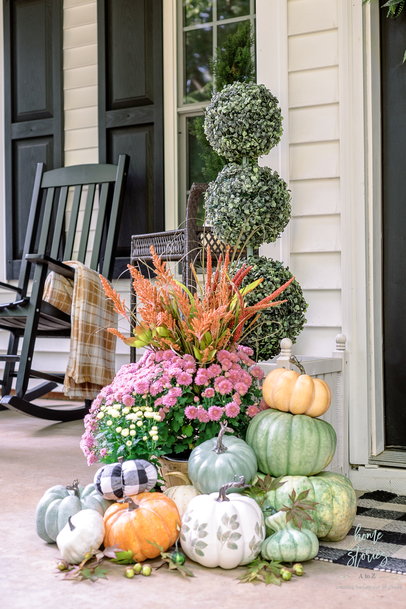pile of colorful pumpkins styled on porch