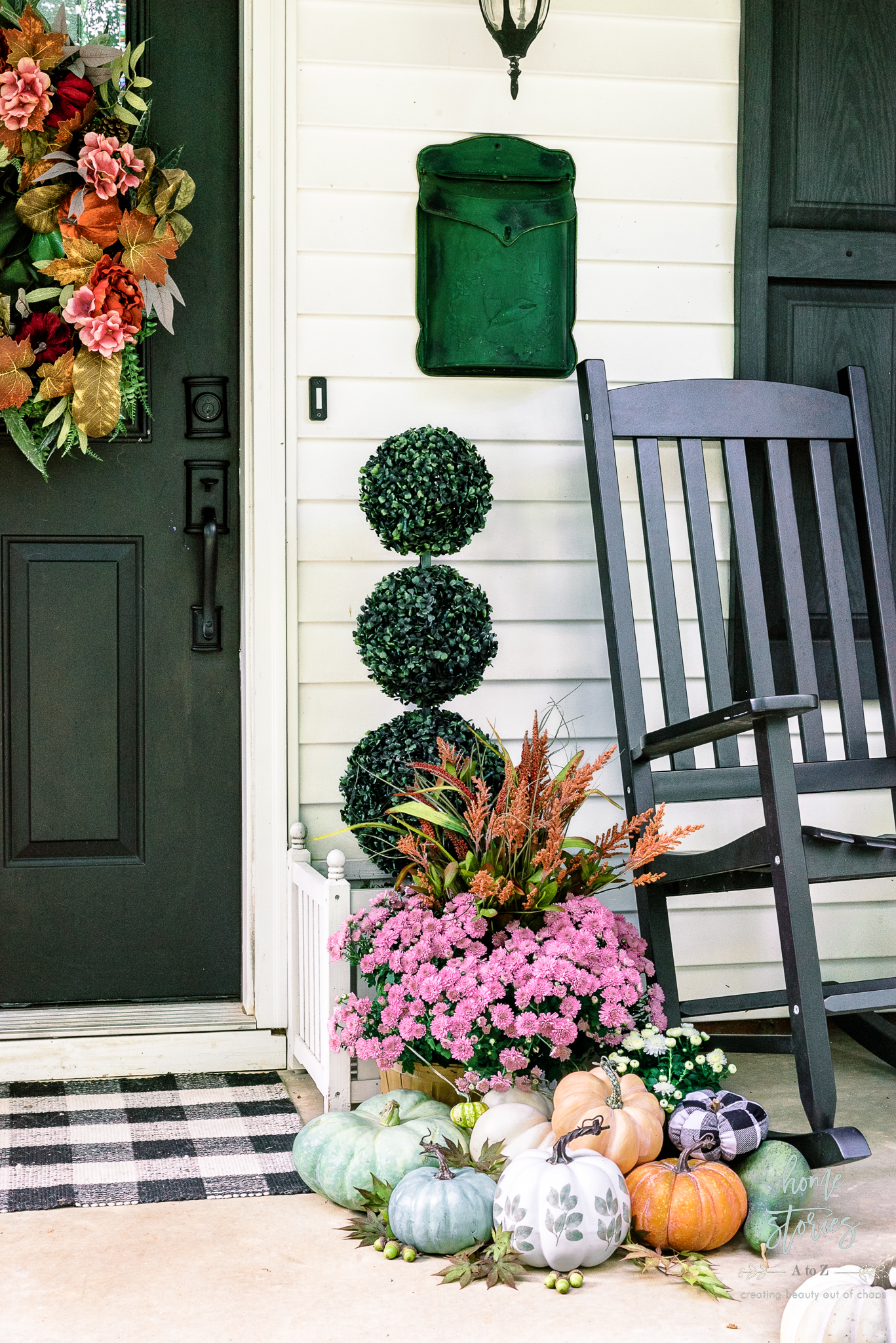 fall porch topiary with mums and pumpkins